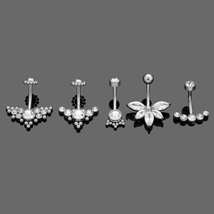 Row of five 316L stainless steel navel rings with cubic zirconia flower designs