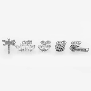 Detailed macro of 316L stainless steel crown and dragonfly zircon dermal anchor tops