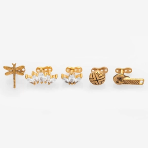 Detailed views of 316L steel crown and dragonfly dermal tops with zircon inlays