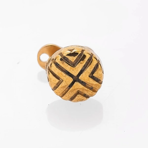 Macro view of a 316L gold crown dermal anchor with textured geometric engraving
