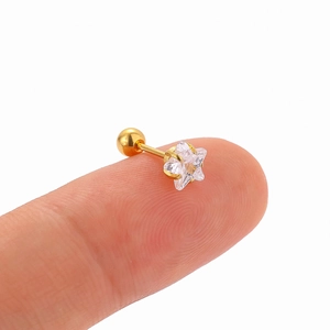 Macro detail of 316L stainless steel star zircon cartilage earring with screw ball back