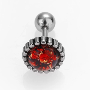 Macro shot of surgical steel cartilage barbell earring with red opal galaxy inlay