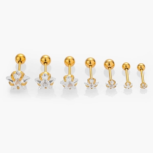 Set of 7 gold star-shaped 316L stainless steel stud earrings with cubic zirconia