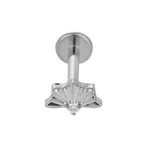 Macro detail of F136 titanium labret stud with fan-shaped zircon and flat back base