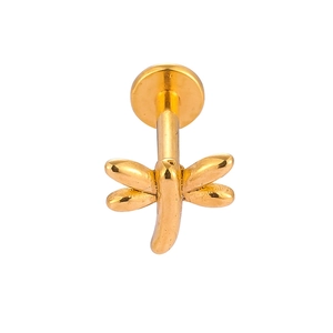 Detailed macro view of a golden dragonfly labret stud with a polished surgical steel base