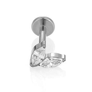Close-up of F136 titanium labret with marquise-cut zircons and polished finish
