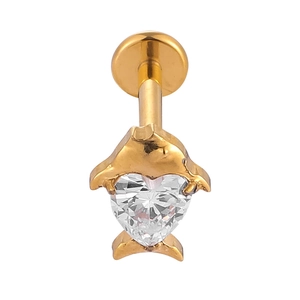 Detailed macro view of golden dolphin cartilage stud with heart-shaped cubic zirconia