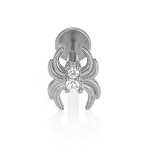 Detailed macro view of 316L stainless steel spider labret stud with inlaid zircons