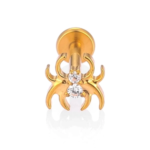 Detailed view of a gold-plated spider labret stud featuring sparkling cubic zirconia stones