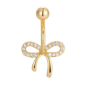 Macro shot of gold navel ring featuring a bow tie design with sparkling white zircon stones