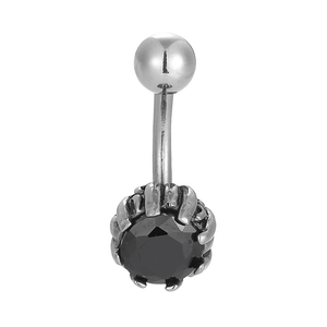 Detailed macro shot of vintage silver belly button ring with a claw-set black gemstone