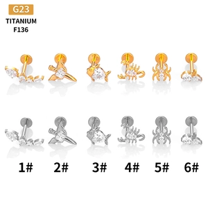 F136 titanium labret studs with zircon in scorpion, fish, and heart shapes