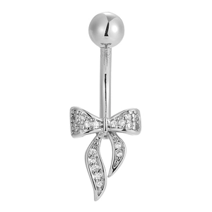 Close-up of silver navel ring with sparkling zircon-studded bowknot design on white background