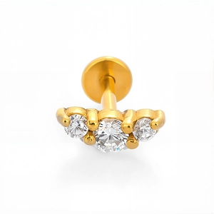 Macro view of gold 316L stainless steel labret stud with three curved zircons