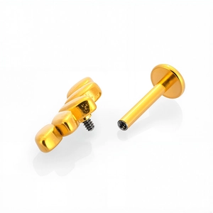 Piercing labret de acero 316L dorado con diseño de flor y base plana ajustable