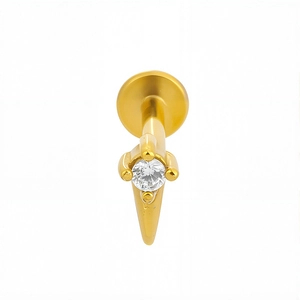 Detailed view of gold labret stud with round zircon stone and sharp conical design