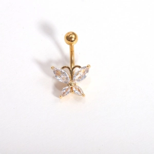 Macro view of gold butterfly belly ring featuring sparkling cubic zirconia stones