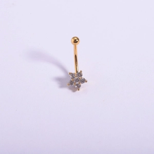 Detail of 316L stainless steel navel ring with gold plated flower and cubic zirconia