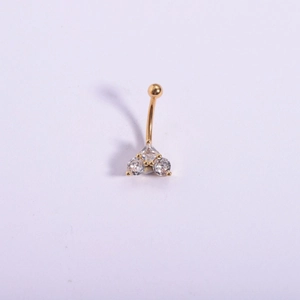 Macro shot of 316L stainless steel gold-plated navel ring with three cubic zirconia gems
