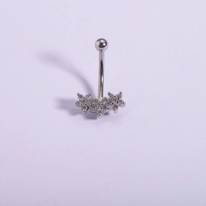 Detailed macro view of 316L stainless steel navel ring with triple flower CZ pendant