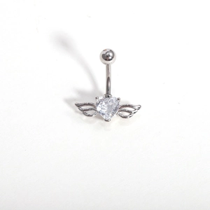 Close-up of heart zircon belly ring with detailed silver wings and polished finish