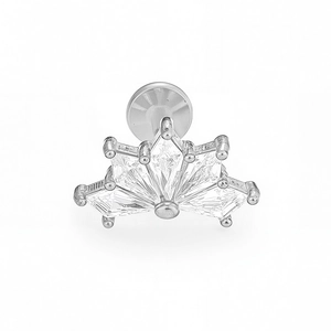 Macro detail of silver labret stud featuring fan-shaped baguette cubic zirconia stones