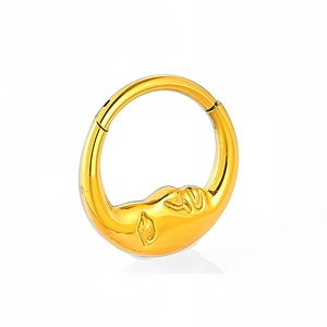 Macro view of gold crescent moon face relief on 316L stainless steel seamless piercing ring
