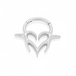Macro detail of G23 titanium clicker ring with silver heart and thorn design for septum piercing