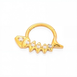 Macro shot of titanium gold fishbone clicker ring with six cubic zirconia gems