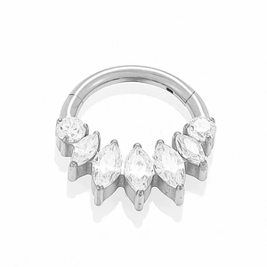 Close-up of titanium clicker ring with marquise and round cubic zirconia in silver finish