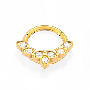 Detailed macro shot of golden clicker piercing with seven sparkling cubic zirconia stones
