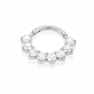Detail of G23 titanium septum ring featuring seven round zircons in a prong setting