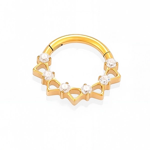 Detailed close-up of golden titanium nose ring with six sparkling white zircon gemstones