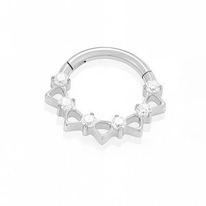 Close-up of titanium clicker ring featuring five cubic zirconia stones in crown settings