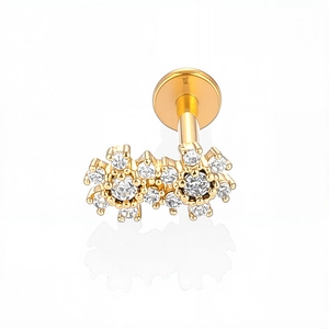 Detailed macro view of the 316L stainless steel labret featuring a gold zircon flower cluster
