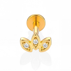 Macro view of gold 316L stainless steel labret stud with zircon flower design