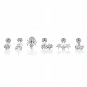 316L stainless steel labret stud set featuring spider and flower designs with white cubic zirconia