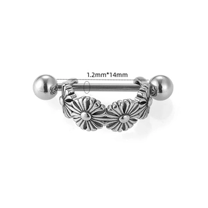 Macro view of 316L stainless steel nipple bar with daisy flower pendant details