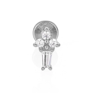 Macro view of silver stainless steel lip stud with four claw-set cubic zirconia stones