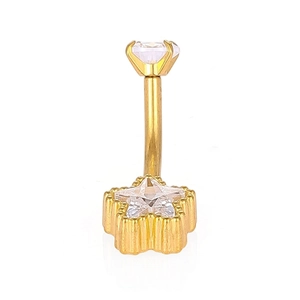 Detail of gold navel ring with 316L stainless steel star shape and clear zircon stones