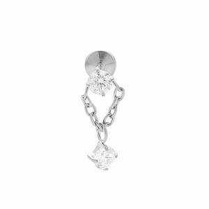 Macro detail of F136 titanium chain pendant labret with shiny dual cubic zirconia studs