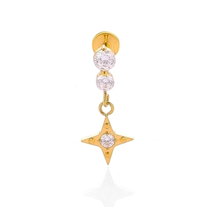 Macro detail of F136 titanium gold flower chain lip stud with star pendant and clear zircon