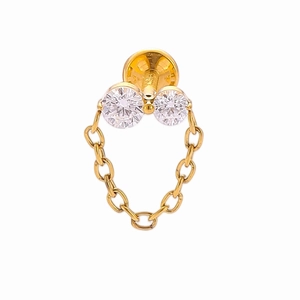 Close-up of golden titanium flower chain pendant for piercing with clear gemstones