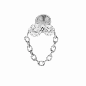 Macro detail of F136 titanium floral chain labret stud with sparkling zircon gemstones