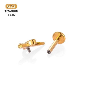 G23 titanium flat back piercing stud with gold dagger top and internal thread design