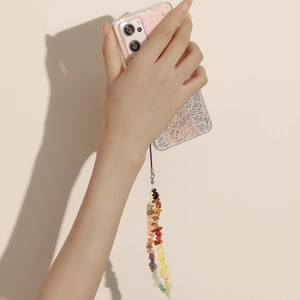 Handmade colorful stone phone lanyard strap and gradient glitter case held by hand