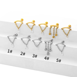 Detailed view of stainless steel labret studs with heart and star zircon dangles