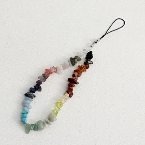 Detail of colorful natural crushed gemstone phone charm with handmade braided steel wire