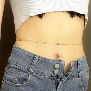 Detailed view of colorful enamel link chain on denim jeans for a summer beach look