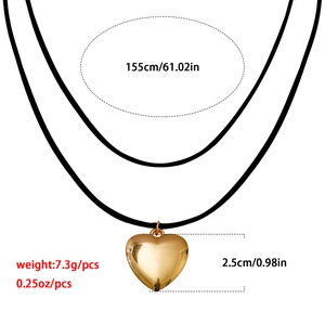 Collar gargantilla ajustable de cordón negro con gran colgante de corazón dorado y tallas